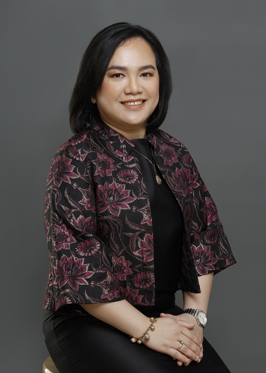 Professional portrait of Atty. Rizzle May R. Ostia-Alburo, a female lawyer sitting and facing slightly to the right, wearing professional business attire.