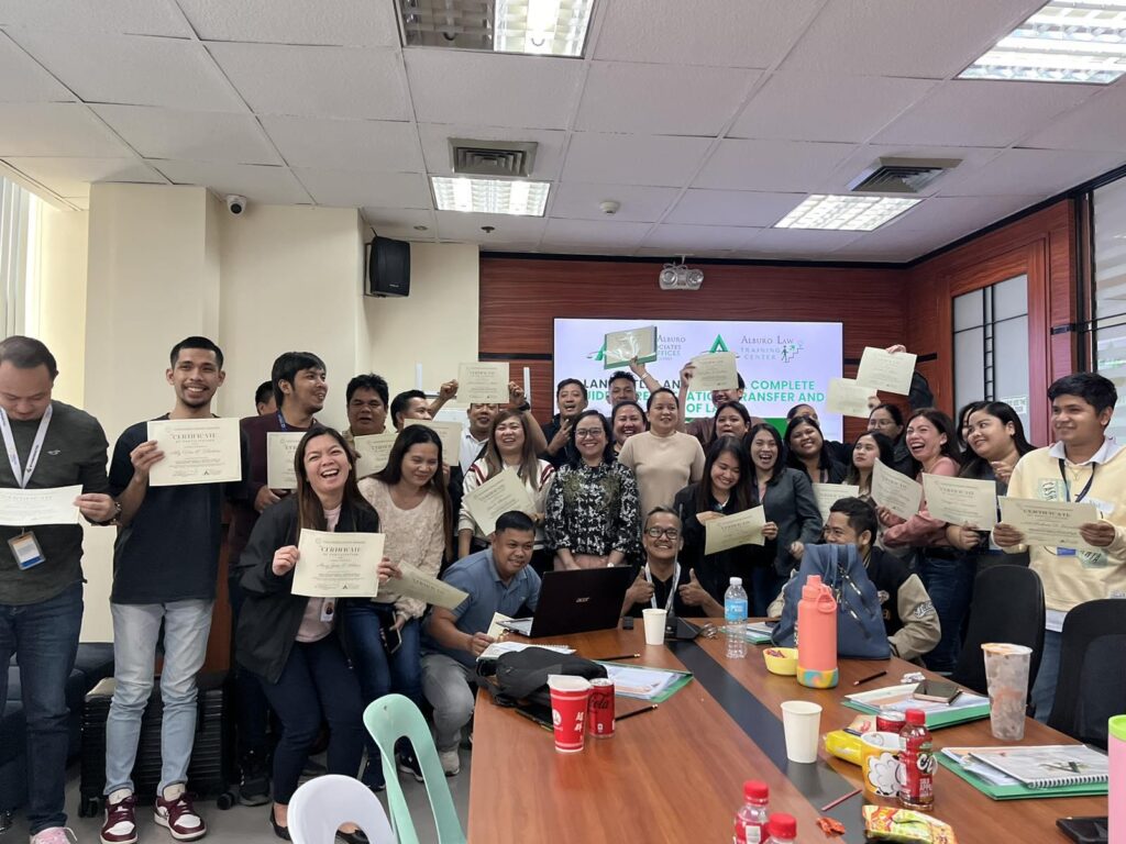Participants holding certificates after the Alburo Law Training Center in-house seminar on land titles and deeds for a real estate company